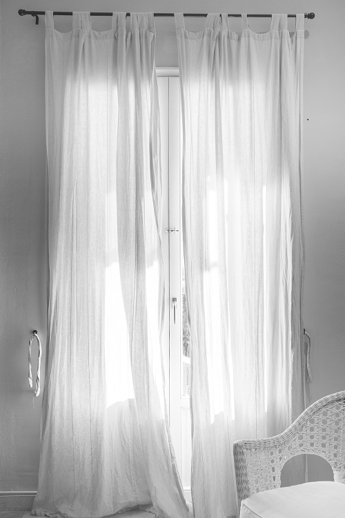 Curtains are simple but effective window treatments. Photo by Christopher Martyn on Unsplash.com