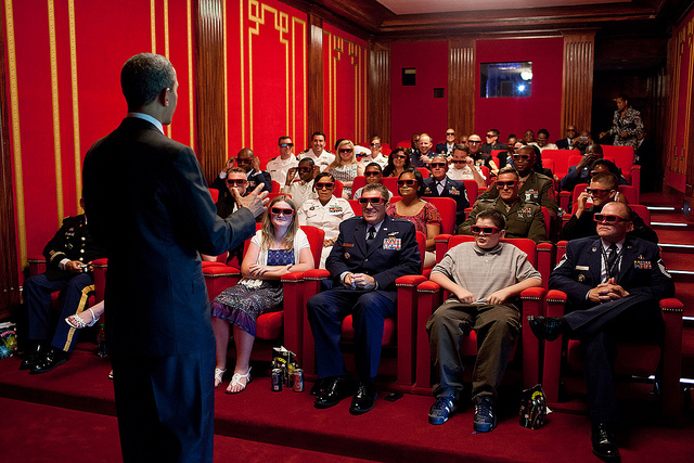 Former US President Barack Obama entertains in the White House movie theater. Pete Souza took this photo on May 25, 2012.