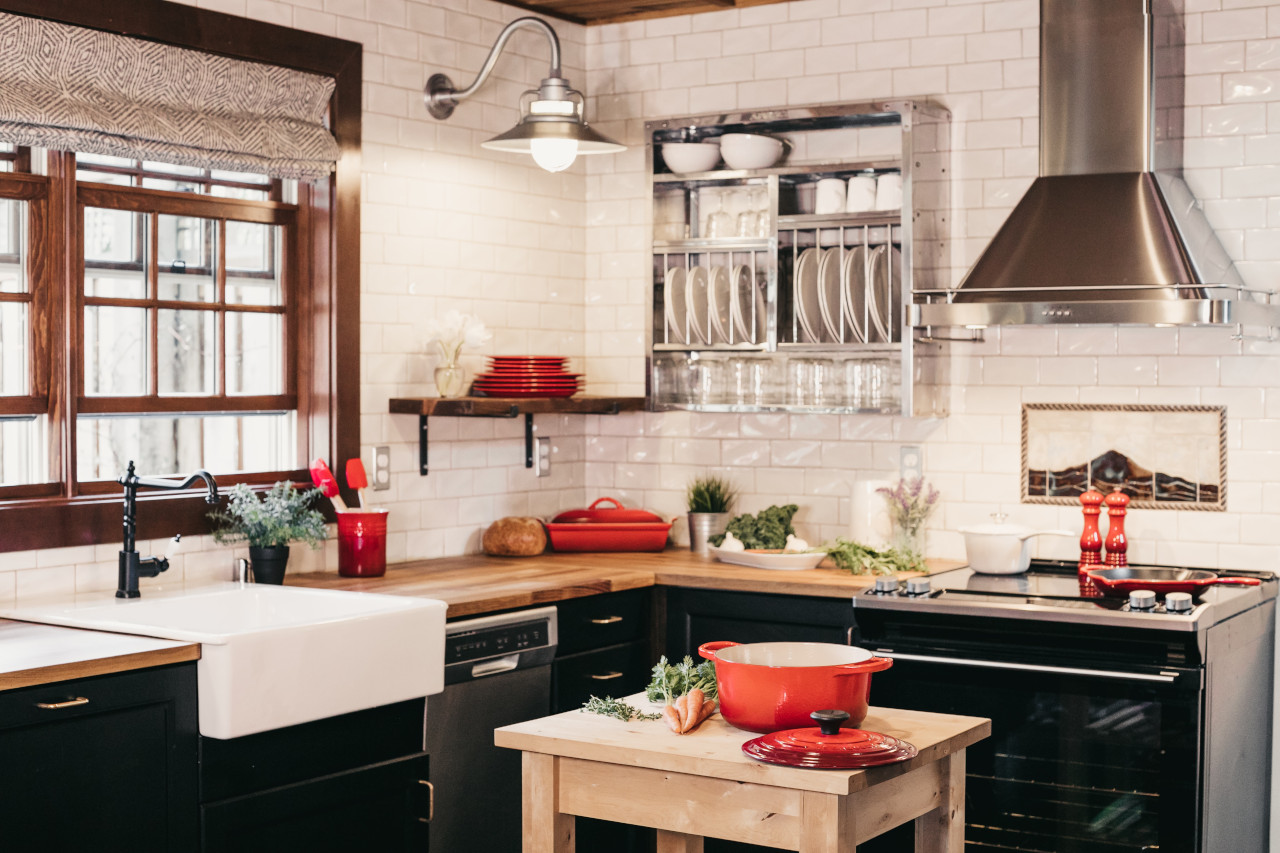 Black and White Kitchen With Red Dishes and Accessories -- Photo Courtesy of Becca Tapert