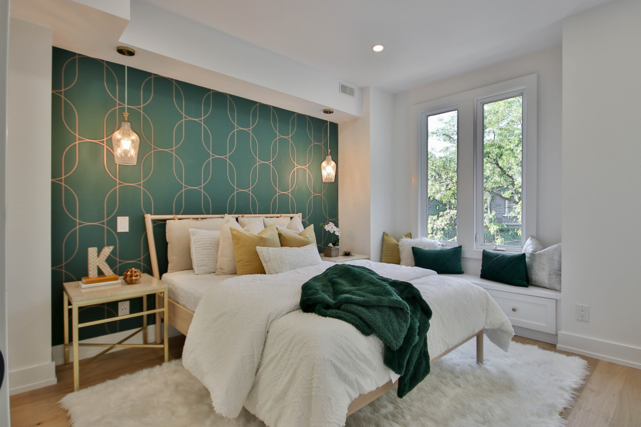 Bedroom Decorating Idea Featuring Hunter Green Wallpaper Statement Wall Plus Shag Rug, Window Seat Alcove, and Decorative Pillows -- Photo Courtesy of Sidekix Media