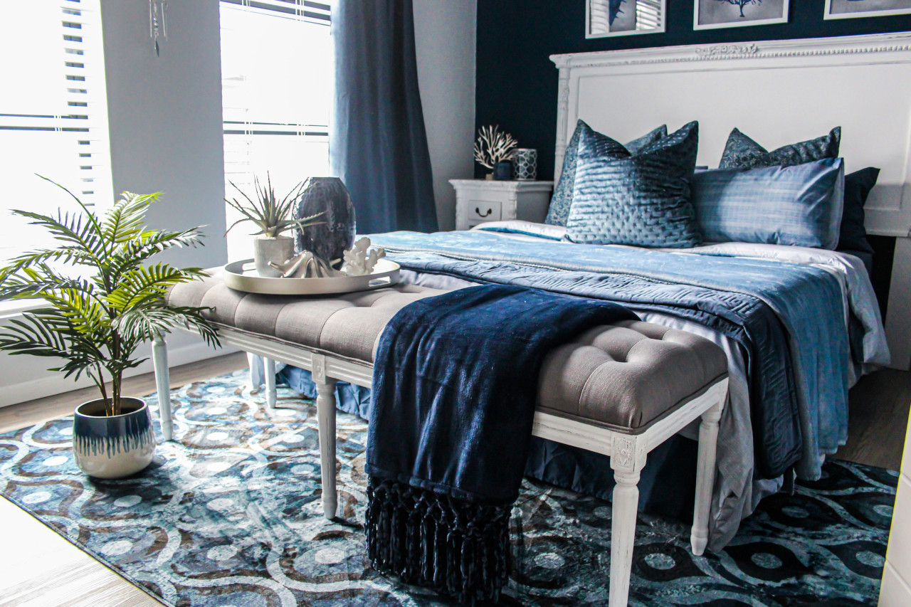Restful Bedroom Decorated With Blue Velvet Throw, Blue Ogee Rug, Blue Curtains  and Other Blue Textiles -- Photo Courtesy of Devon Janse Van Rensburg at Unsplash