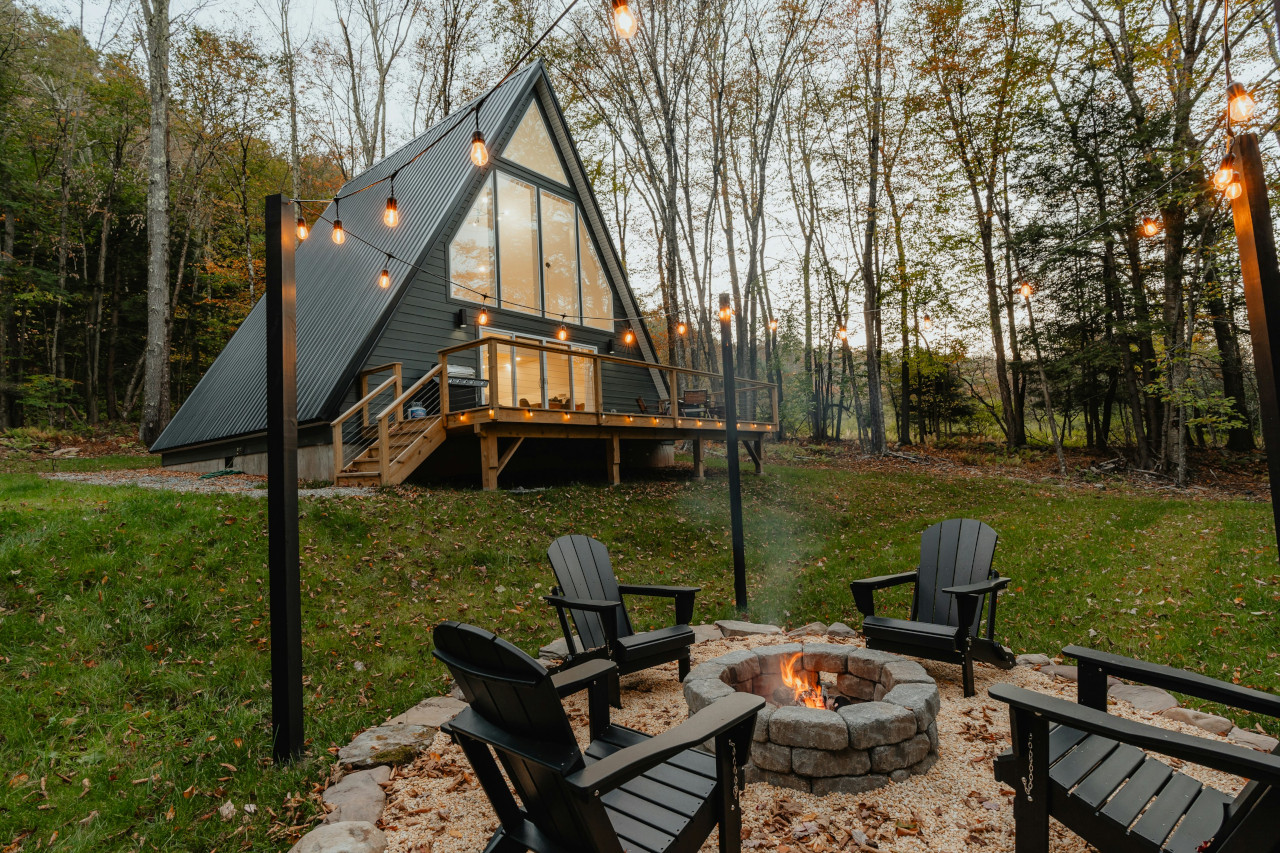 A-Frame Home Exterior With Outdoor Fire Pit -- Photo Courtesy of Clay Banks 
